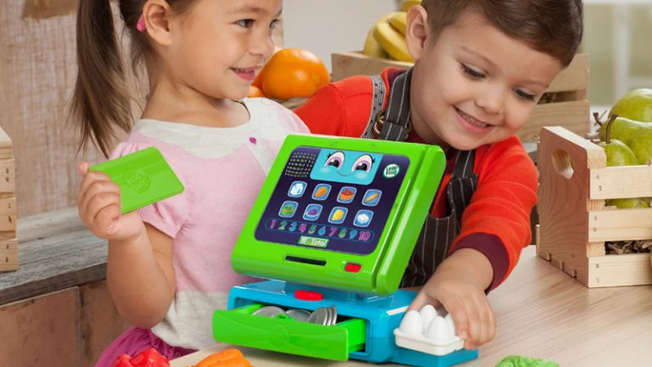 Close up on a plate of mashed potatoes, topped with baked pork chops with cream of mushroom soup, and a side of green beans.