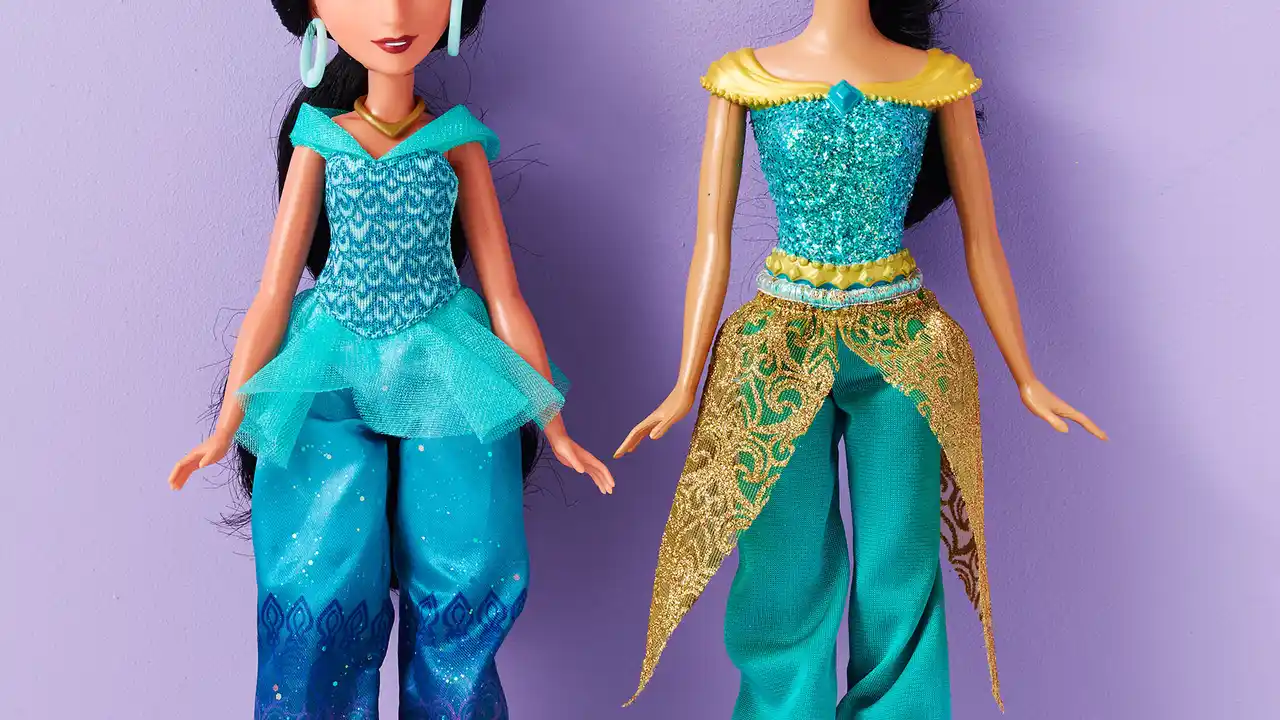 Close up on a plate of mashed potatoes, topped with baked pork chops with cream of mushroom soup, and a side of green beans.