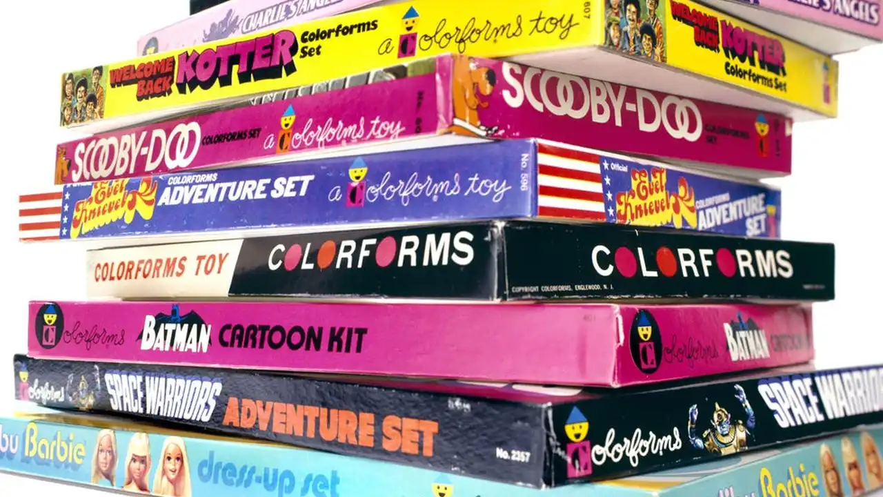 Two mint chocolate milkshakes with whipped cream and green sprinkles.