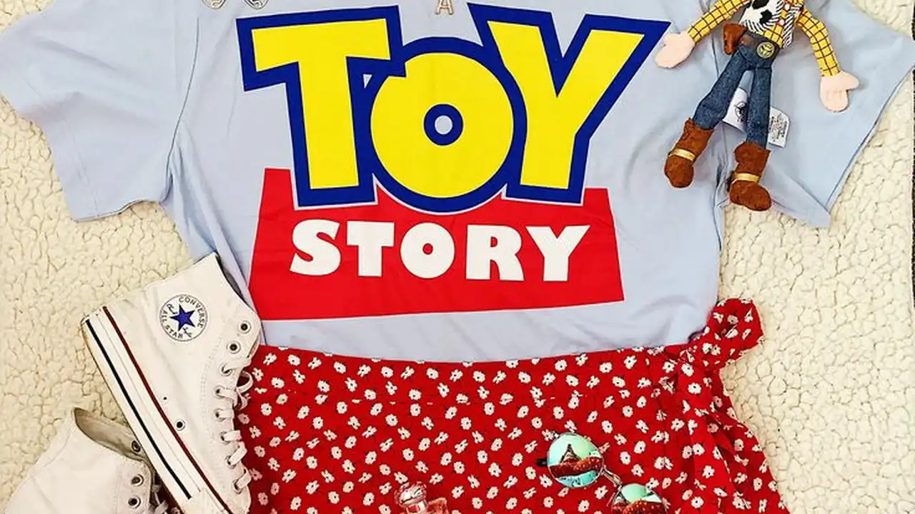 Close up on a plate of mashed potatoes, topped with baked pork chops with cream of mushroom soup, and a side of green beans.