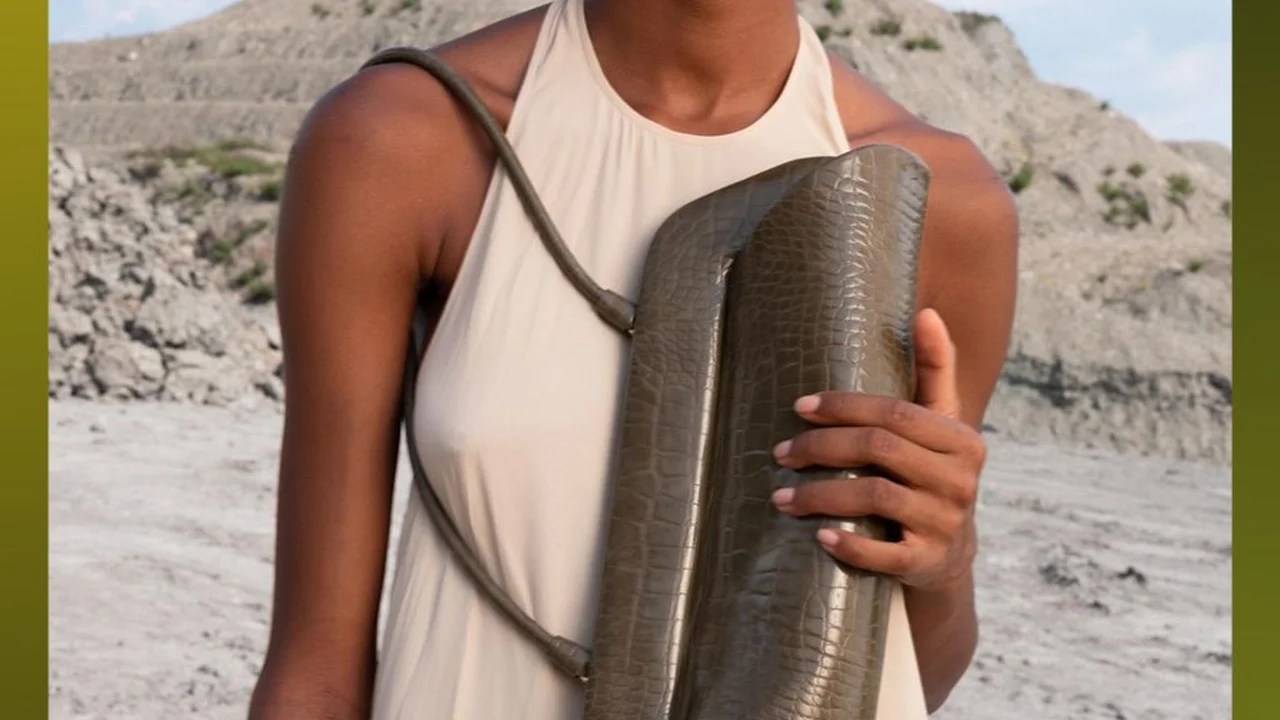 Close up on a plate of mashed potatoes, topped with baked pork chops with cream of mushroom soup, and a side of green beans.